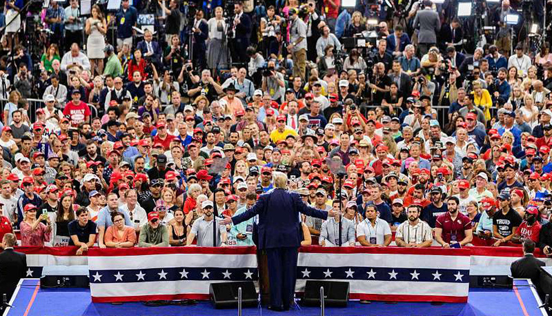 Donald Trump speaks in front of a crowd