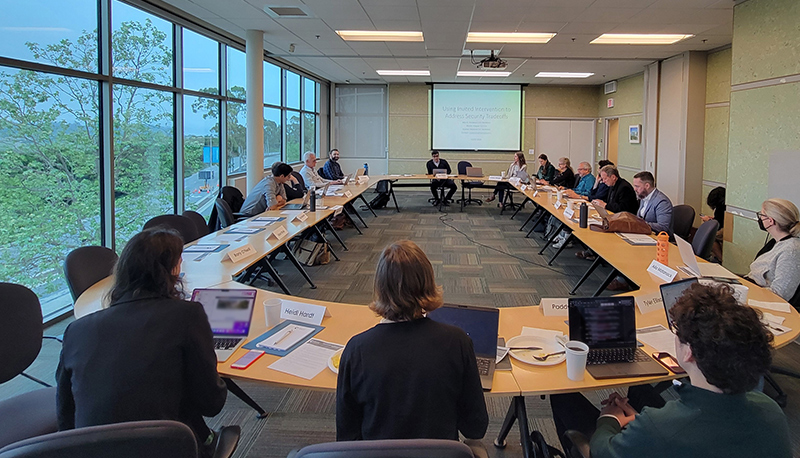 2024 UCCIC attendees seated around conference tables at the UC Santa Barbara Mosher Alumni House.