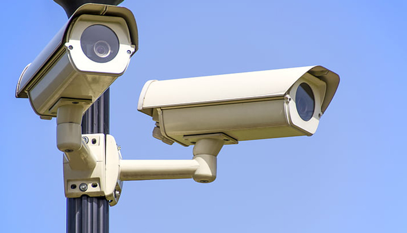 two white surveillance cameras