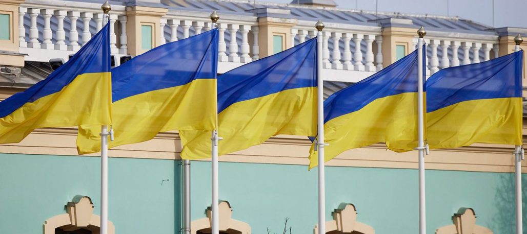 Close-up photo of five Ukrainian flags flying side by side