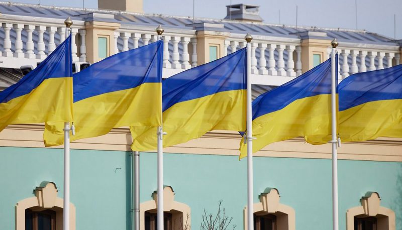 Close-up photo of five Ukrainian flags flying side by side