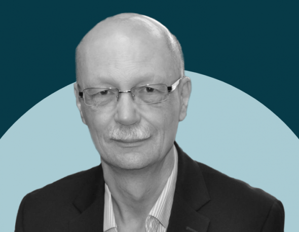 Black and white headshot of David Lake overlayed on a two-tone teal and blue background