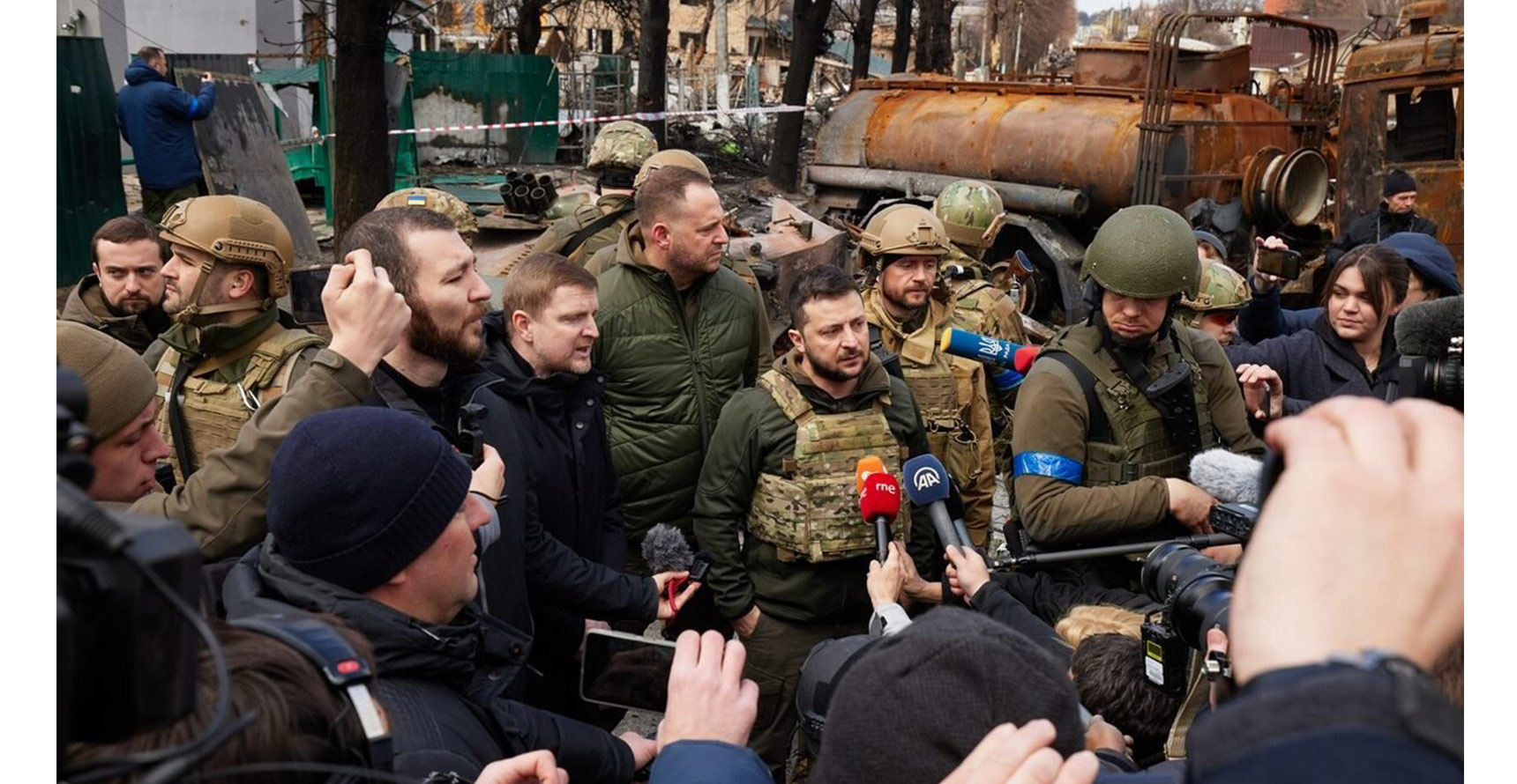Ukrainian president Volodymyr Zelenskyy answers questions from the media in Bucha, 2022.