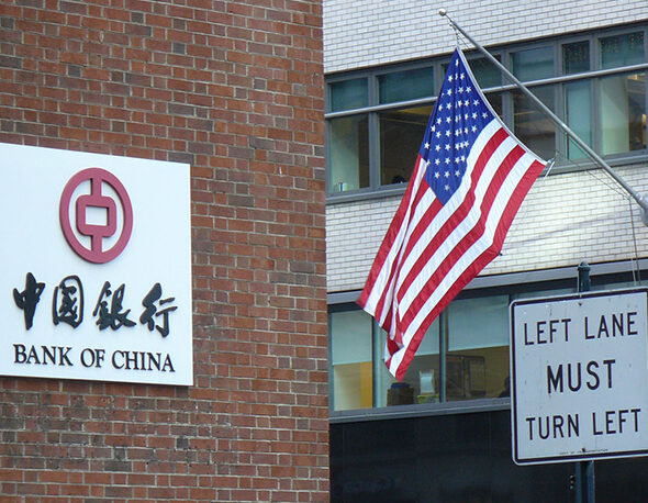 Image of the China Bank in New York City with an American flag flying nearby.